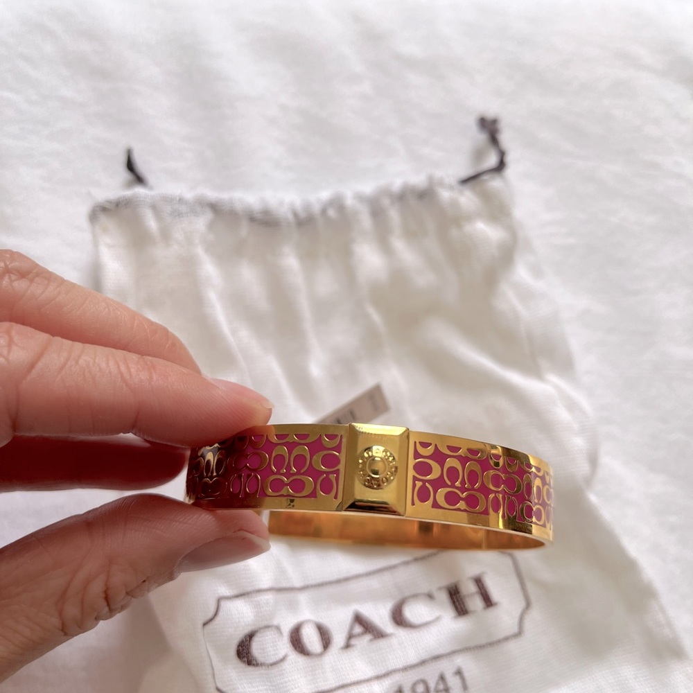 Brand new COACH gold and dark pink bangle bracelet. Item F96855